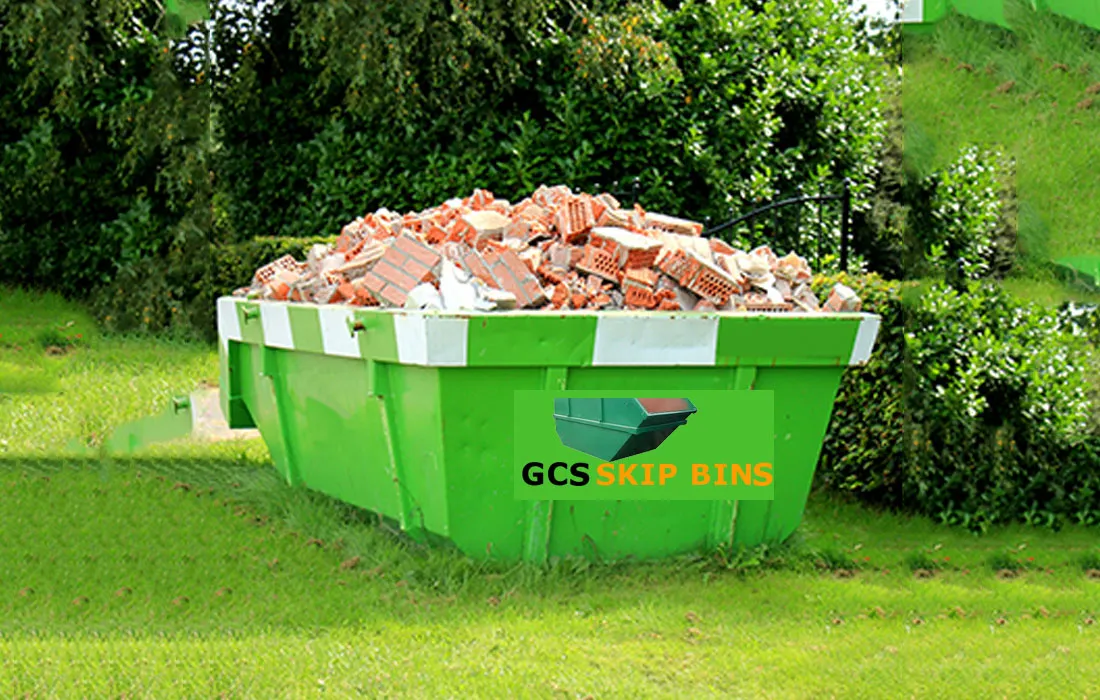 Skip bin filled with bricks from a construction site
