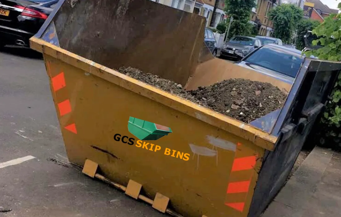 Skip bin filled with broken concrete from a demolition job